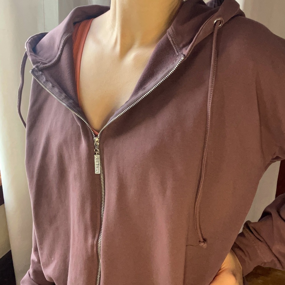 Meshki zip up hoodie. Adjustable drawstrings. Size small, fits oversized.